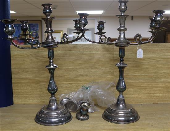 A pair of plated candelabra (a.f.) and a quantity of assorted sconces.